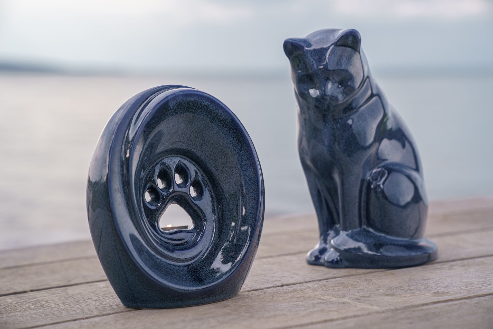Pet Cremation – How Much Does it Cost - Blog post by Pulvis. Photo of Three cat urns for ashes.