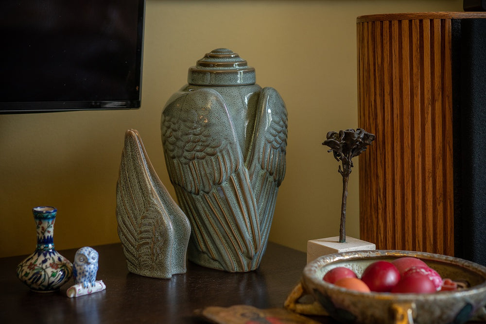 Wings ceramic set for human ashes by Pulvis Art Urns. Colour - oily green melange