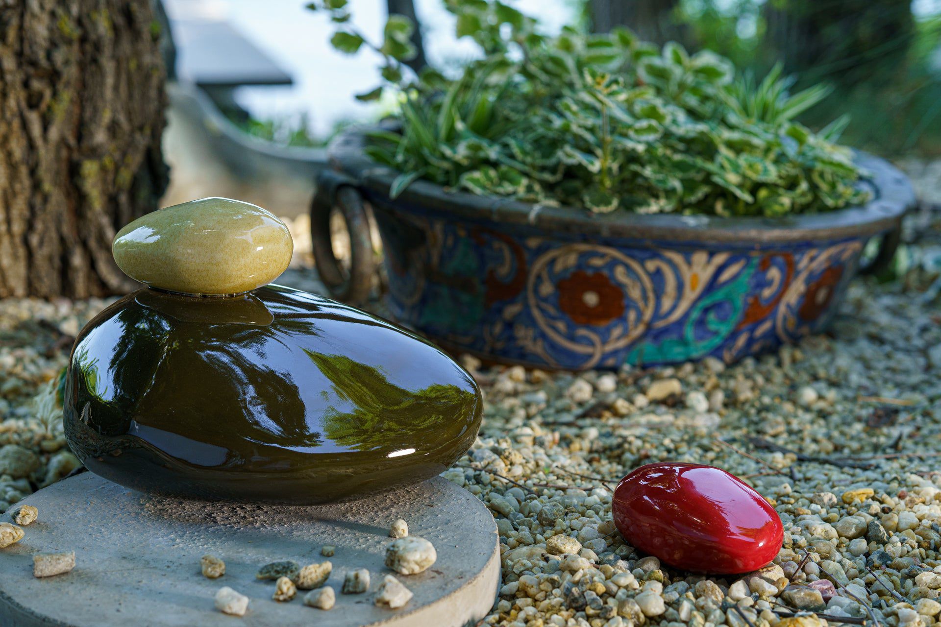 Stone Handmade Cremation urn for ashes. Photo of large urn and keepsake by Pulvis Art Urns.