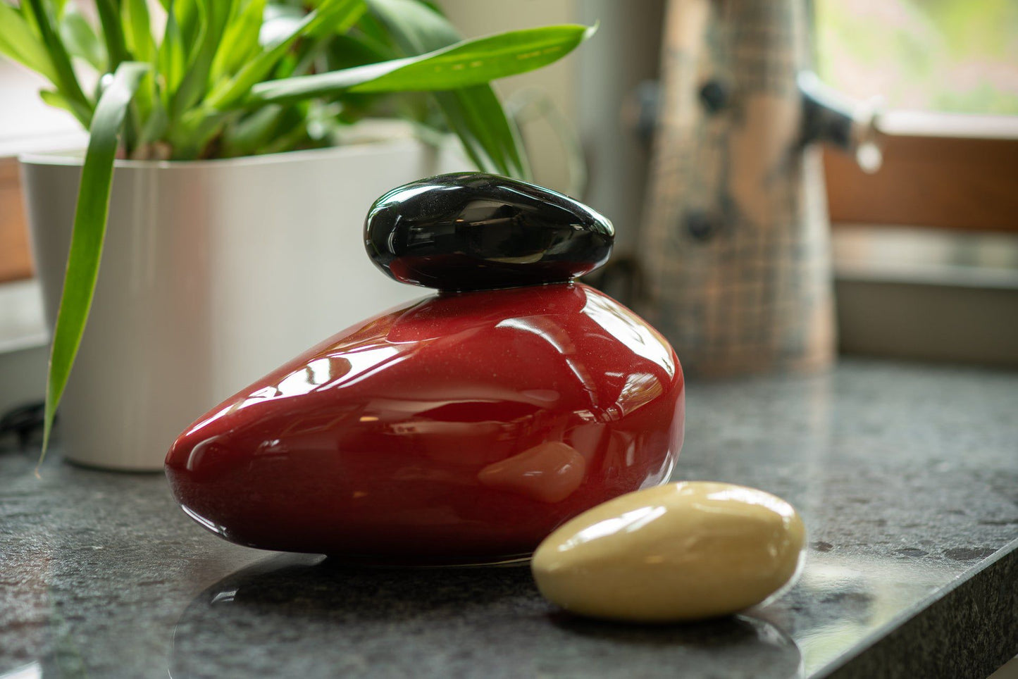 Resonance Handmade Cremation urn for ashes. Photo of large urn and keepsake by Pulvis Art Urns.