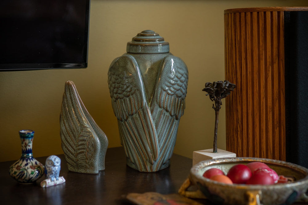 
                  
                    Ceramic Art Urn for Ashes - Wings - set (Oily green melange colour  ) by Pulvis Art Urns 
                  
                